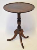 Mahogany circular pedestal table with snap top and tripod base, 52cm wide