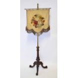 19th century mahogany pole screen, with stumpwork panel, brass shaft and mahogany tripod base, 146cm