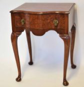 Reproduction mahogany side table with serpentine front and single frieze drawer on cabriole