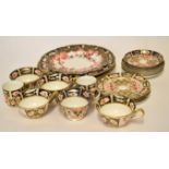 Collection of Royal Crown Derby wares in Imari style comprising three large plates, a plate with