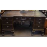 Early 20th century mahogany twin pedestal desk, applied throughout with lion mask mounts and on claw