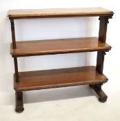 19th century mahogany three-tier buffet with planked ends with scrolling supports raised on four bun