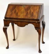 Mahogany bureau, fall front over shaped frieze, raised on cabriole supports with pad feet, 79cms