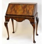 Mahogany bureau, fall front over shaped frieze, raised on cabriole supports with pad feet, 79cms