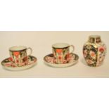 Group of Royal Crown Derby wares comprising two coffee cans and saucer, and a small baluster vase,