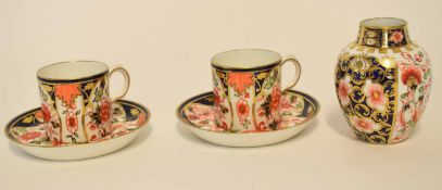 Group of Royal Crown Derby wares comprising two coffee cans and saucer, and a small baluster vase,