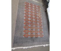 Mid-20th century wool carpet with replicating grey concentric borders to an ochre lozenge field, 244