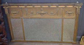 Adam style overmantel mirror, crested with neo-classical urns etc, gilded throughout and with