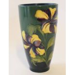 Moorcroft vase of tapered form with anemones on a green ground, 18cm high