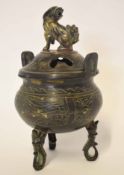 Oriental metal ware Koro and cover, bronzed effect, the cover with a reticulated design and dragon