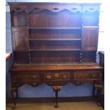 Early 19th century oak dresser, plate rack back with two compartments and the base with three frieze