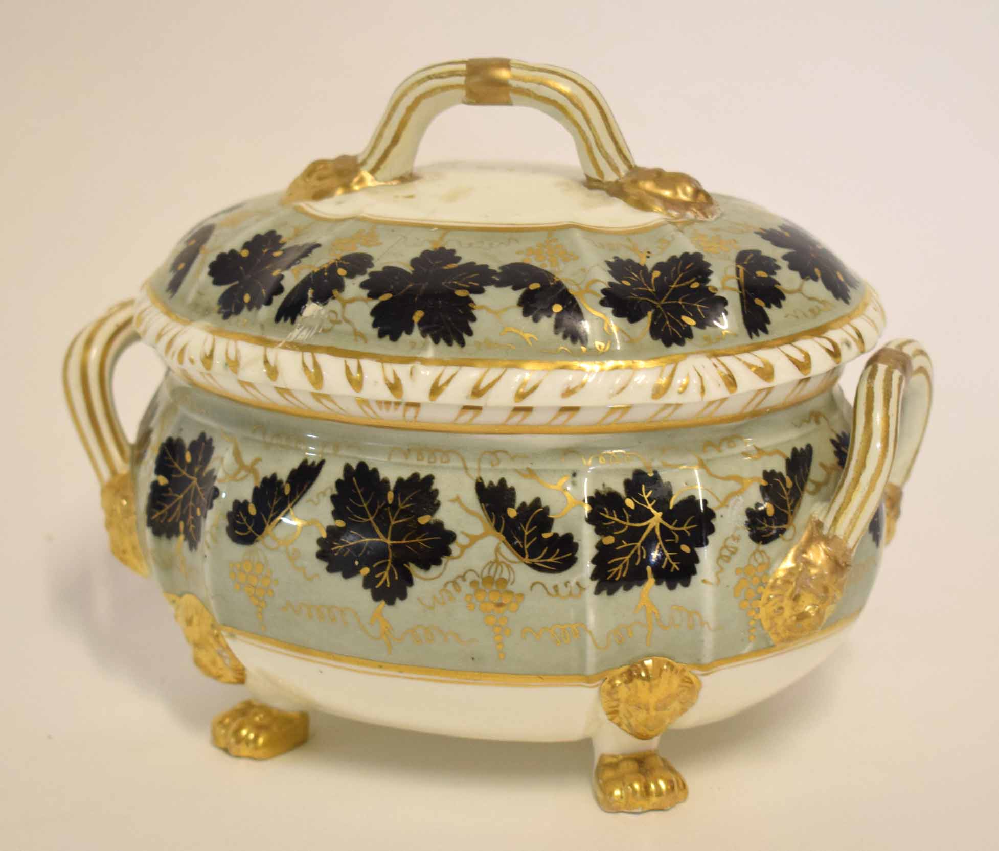 19th century Bloor Derby sucrier and cover of bombe form with gilt line mask handles and feet, the