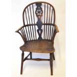 19th century stick back Windsor armchair with wheel splat and with solid seat