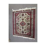 Small late 20th century Caucasian rug, central lozenge and floral designs, mainly red, grey and