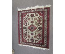 Small late 20th century Caucasian rug, central lozenge and floral designs, mainly red, grey and