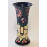Modern Moorcroft vase, signed to base with a scrolling tube lined design of flowers and plants, 25cm
