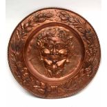 Early 20th century embossed copper wall mounting panel, rope twist border enclosing a fruiting