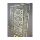 Caucasian style wool carpet (faded), central panel of lozenges and triple gull border, mainly