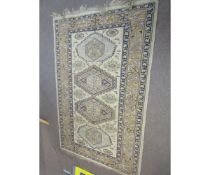 Caucasian style wool carpet (faded), central panel of lozenges and triple gull border, mainly