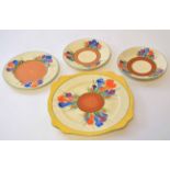 Group of Clarice Cliff wares decorated with the Crocus pattern comprising a large plate with