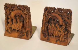 Pair of Chinese wooden carvings mounted on metal bases, the carvings with Chinese figures on