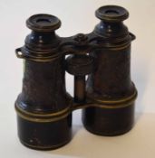 Pair of early 20th century patinated brass binoculars of typical form with screw adjustment, MK V