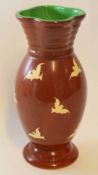 Unusual Clarice Cliff vase with quatrefoil top, the vase with white birds on a brown ground, 32cm