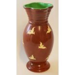 Unusual Clarice Cliff vase with quatrefoil top, the vase with white birds on a brown ground, 32cm