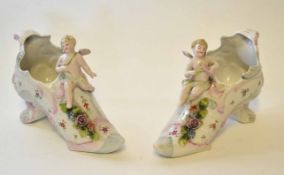 Pair of late 19th century/early 20th century spill holders modelled as shoes with applied cherubs