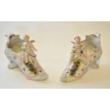 Pair of late 19th century/early 20th century spill holders modelled as shoes with applied cherubs