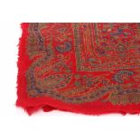 Mid-20th century woollen shawl with predominantly red background with floral lozenge detail within a
