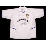 Leeds United shirt, signed by Norman Hunter