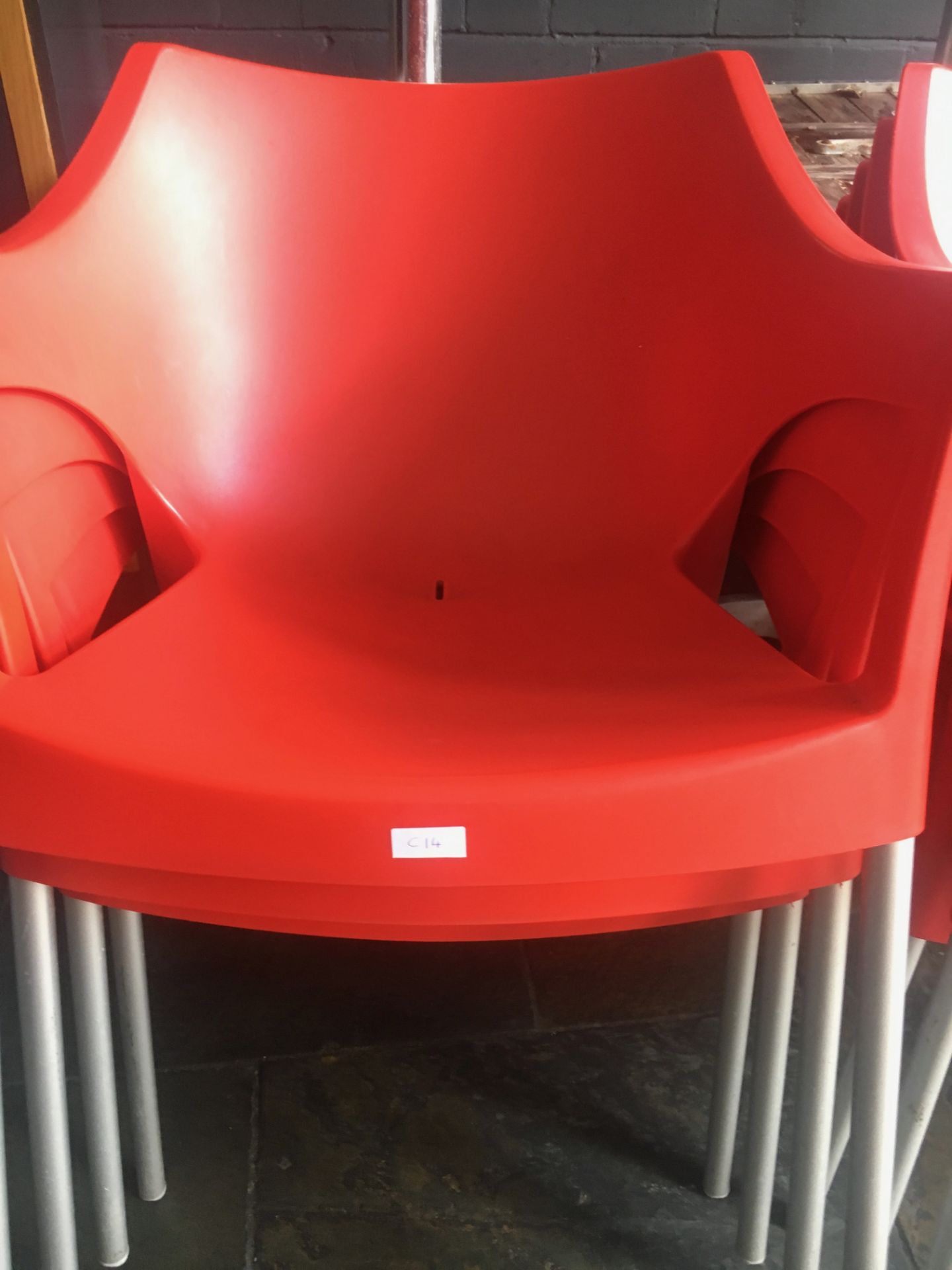 Plastic moulded Outside Chairs, red.