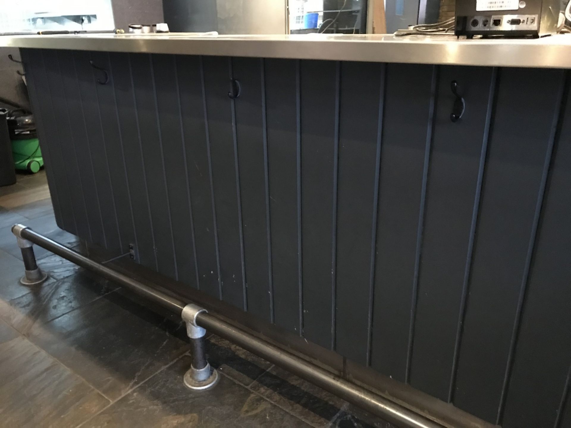 Stainless steel topped high quality wooden Bar, with swept corners to either end, size approx 5.2m