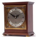 Late 20th century mahogany cased mantel timepiece, Elliot, the plinth shaped case raised on