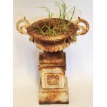 Metal garden urn seated on plinth in Grecian classical style, 47cm high