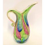 Heavy Murano glass ewer with a streaked design in green and blue on a mottled pink ground, paper