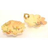 Two Royal Worcester blush ground dishes, one of shell shape, the other with gilt scroll handle, both