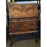 18th century style walnut small bureau, fall front enclosing fitted interior, two short and two full