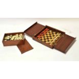 Mahogany box with sliding lid containing bone and ebony dominoes, together with a mahogany folding