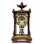 Late 19th/early 20th century American gilt four glass mantel clock, the plinth shaped case