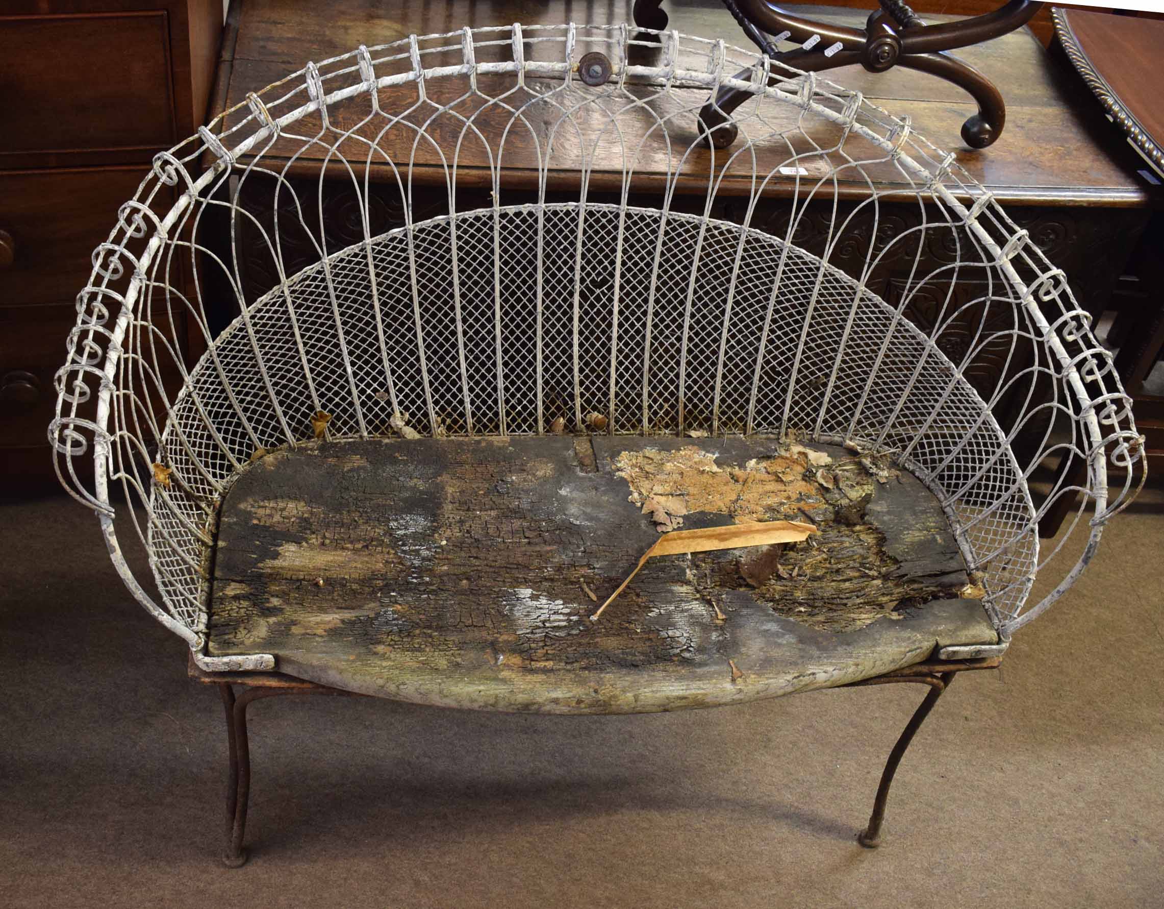Victorian wire work garden seat on cabriole legs with metal lattice work and hooped rail, the seat