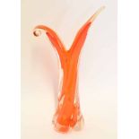 Orange coloured Art Glass vase or ewer, the wrythen body with an orange design, 40cm high