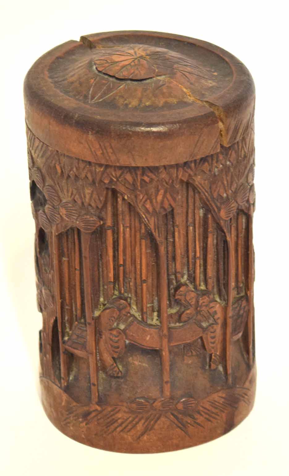 Carved bamboo brush pot and cover, carved with scenes of two figures to the front, 17cm high