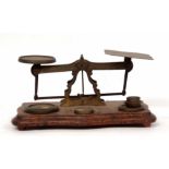 Late 19th century postal scale, the serpentine shaped base set with a pierced frame with shaped pans