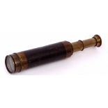 Early 20th century lacquered brass and leather covered three draw pocket telescope of typical form