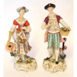 Two Continental porcelain figurines of flower sellers, 16cm high