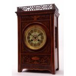 Late 19th century walnut and boxwood inlaid mantel clock, the plinth shaped case with pierced