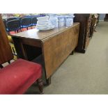 Georgian mahogany drop leaf table of plain form on chamfered supports, 121cm wide