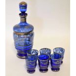 Blue glass decanter with six liqueur glasses, all with a silvered design, decanter 24cm high